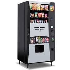 Black and white vending machine filled with snacks and beverages, featuring a digital display and product dispensing slot