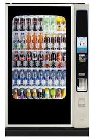 Beverage vending machine with glass front door displaying rows of drinks and snacks, with coin and bill payment slots on the right side.